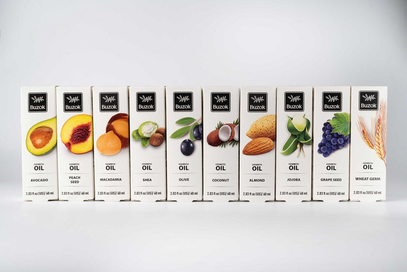 Assorted cosmetic oils for skincare and haircare arranged in minimalist packaging.