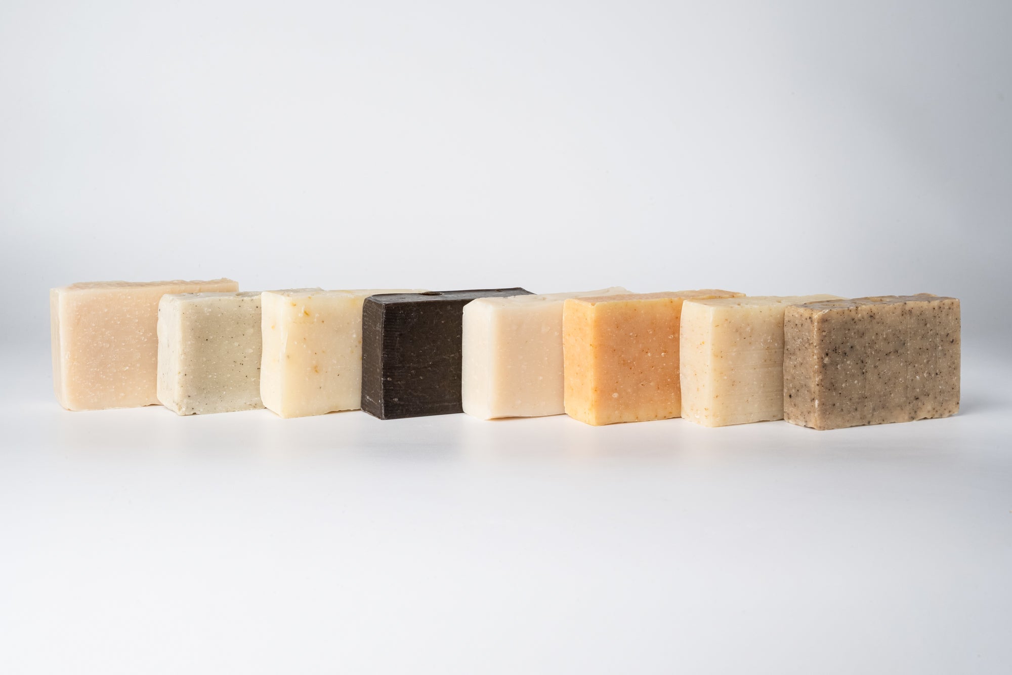 Collection of soap bars arranged neatly on a clean background.